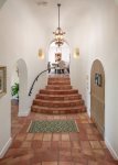 Soaring front hall entry leads to dining room, living room and private master bedroom wing